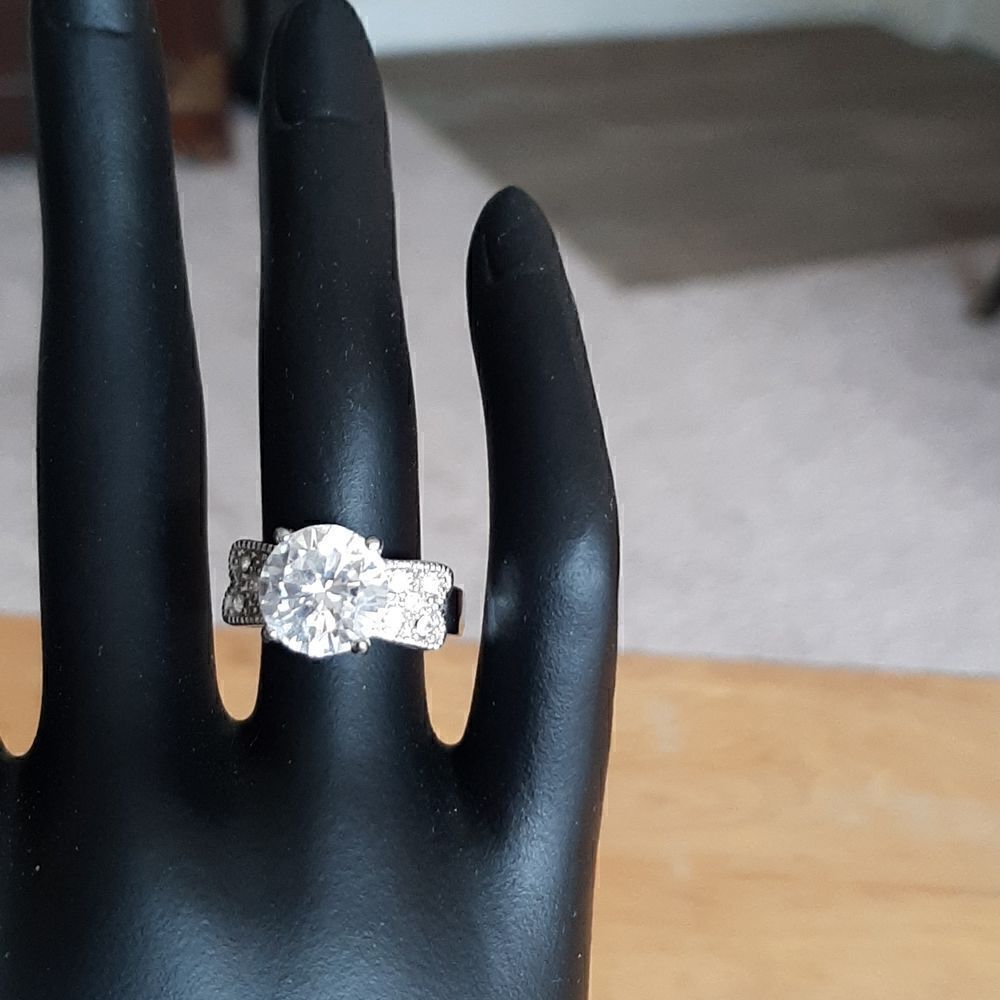 Cubic zeconia ring with large center stone and 5 smaller stones on either side